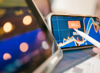 Trader analyzing Bitcoin, Ethereum, and forex options across multiple markets